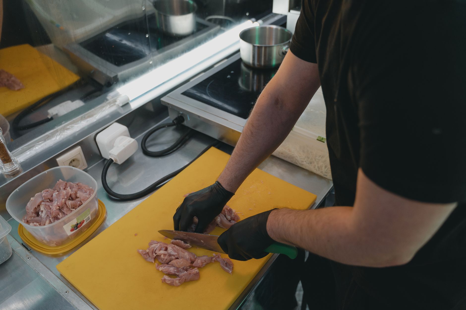 Food safety inspector reviewing controls inside a meat processing plant