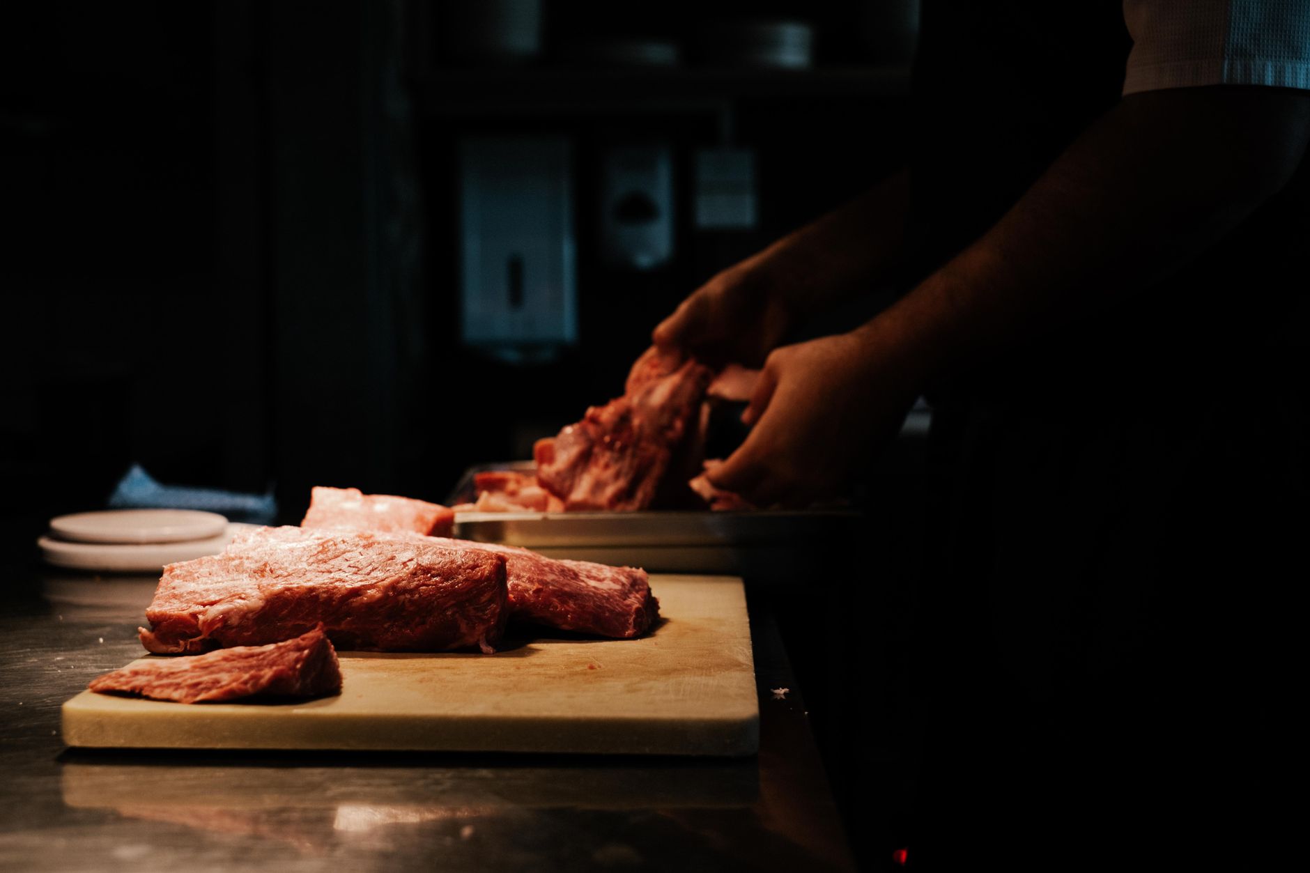 Quality inspector reviewing certification documents at a meat processing plant