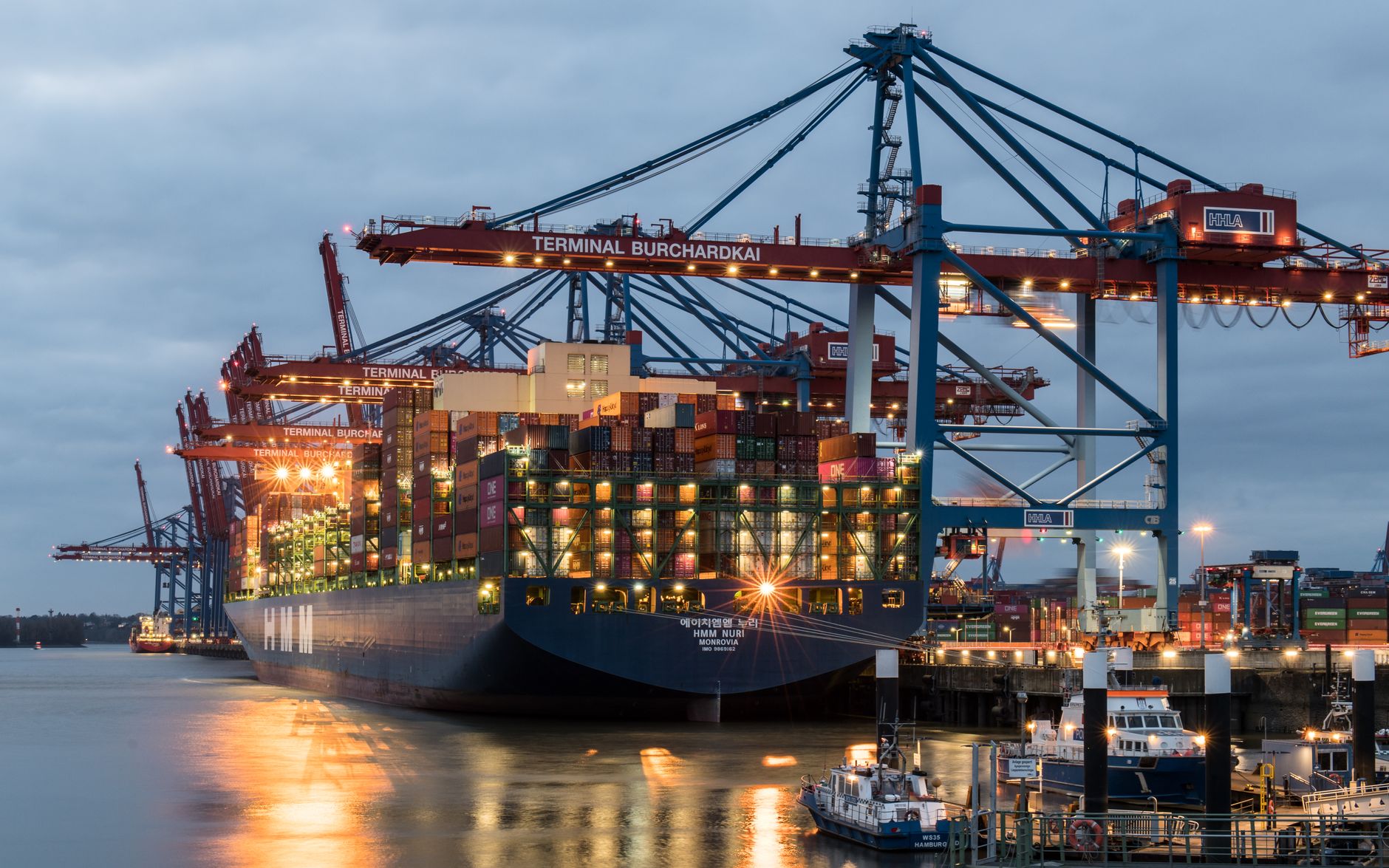 Shipping containers and customs inspection area at a port export terminal
