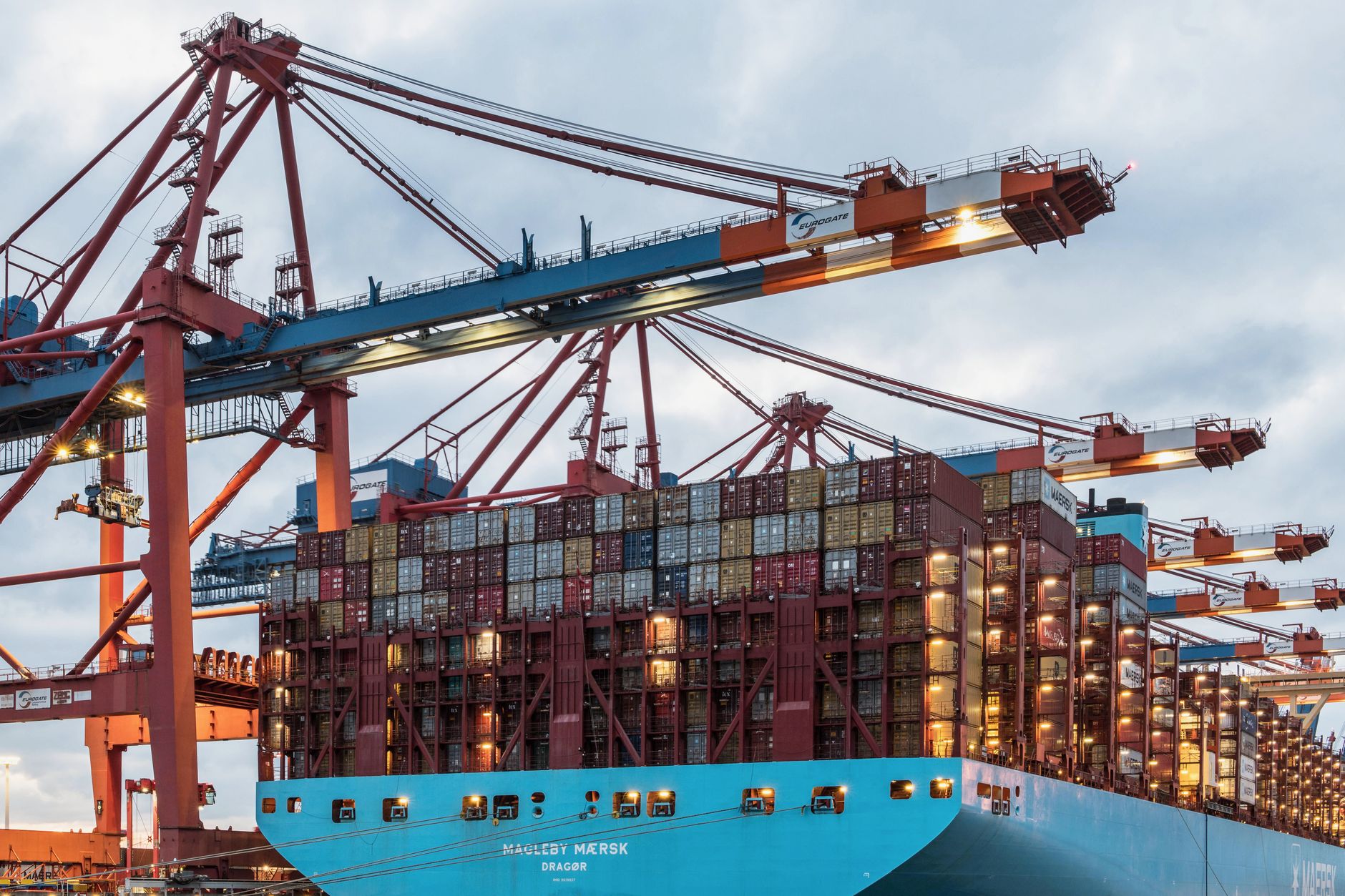Container ship being loaded at a port, illustrating Incoterms 2020 risk transfer points for frozen meat shipments